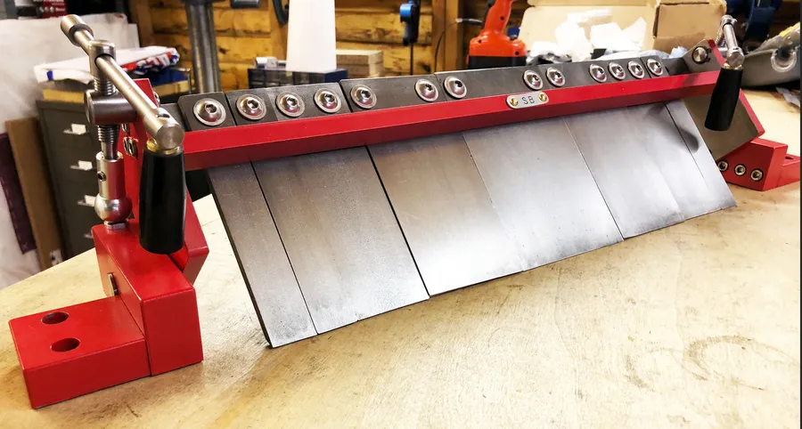 Click to view full size - My box and pan brake modification. Everything you see is custom fabricated apart from the various bolts and the plastic handles for the 2 clamping screws.