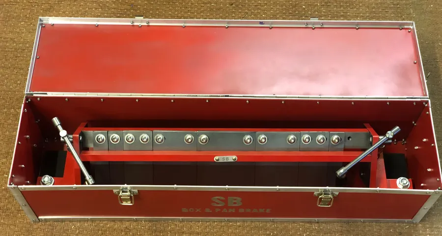 Click to view full size - It's an awkward shape to store, so with some spare metal I riveted a custom box to keep it safe.