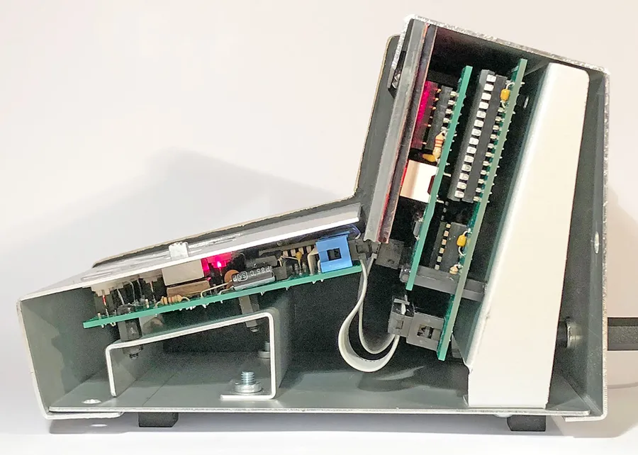 Click to view full size - Inside view of how the PCBs stack together. Switching power supply hidden behind the angled aluminium piece you see on the right.